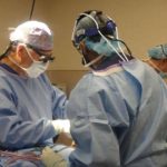 doctors performing jaw surgery on a patient, 