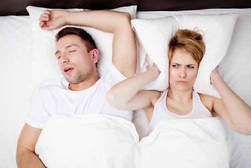 Snoring man and young woman