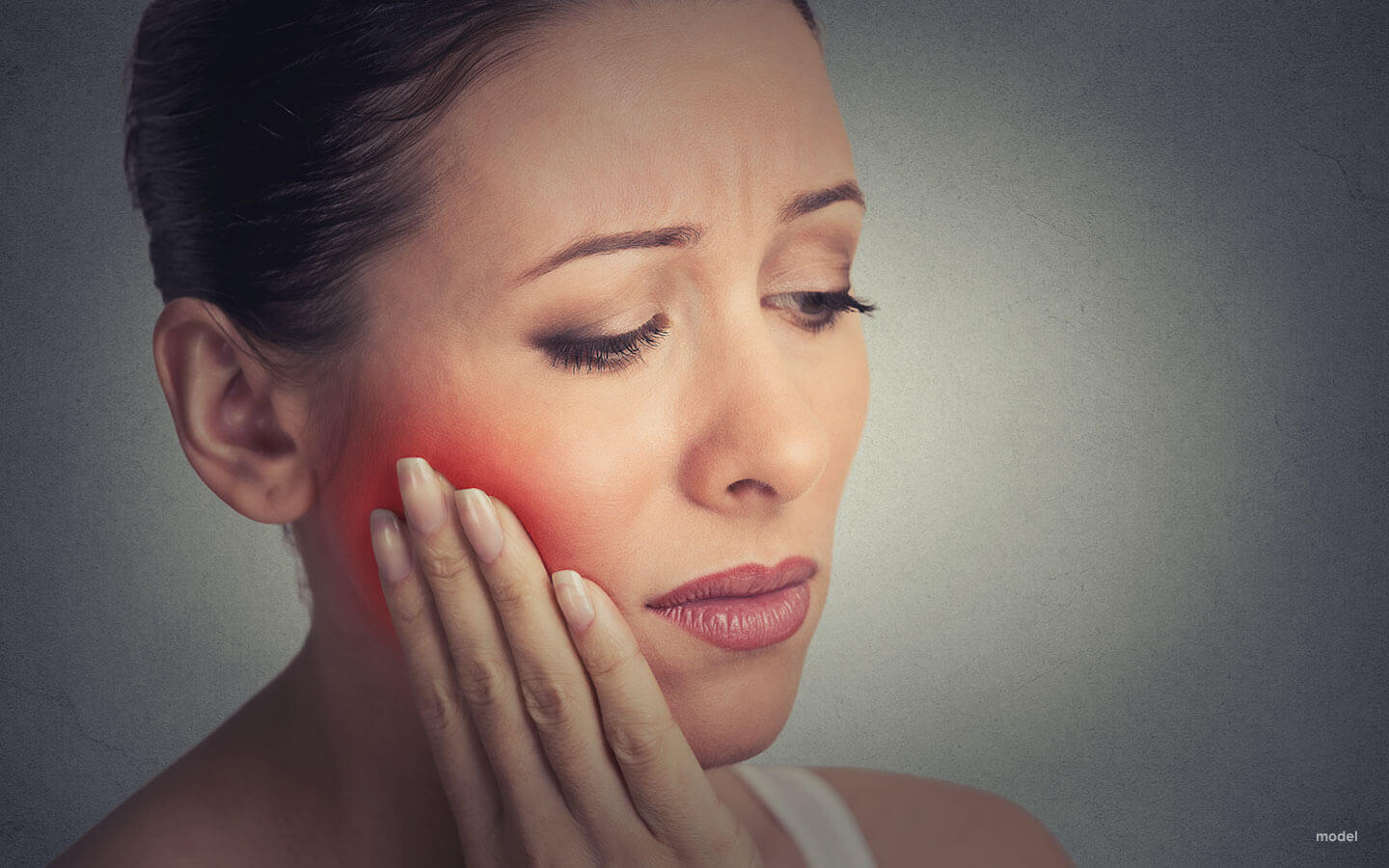 woman with tooth pain