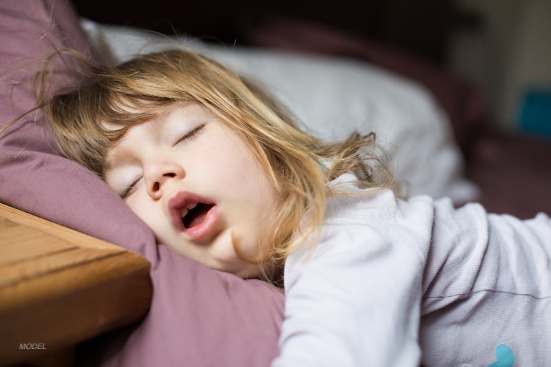 Young girl sleeping with mouth open